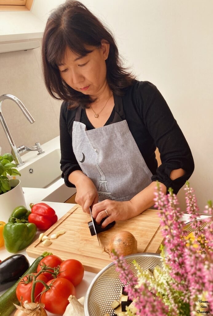 Atsuko cooking in her kitchen
